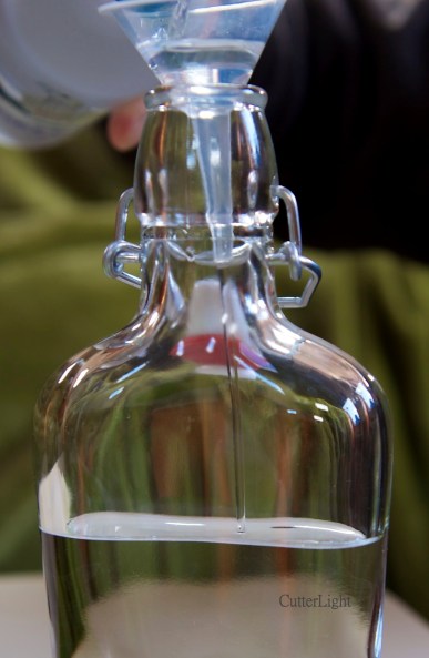vodka pouring into bottle_n